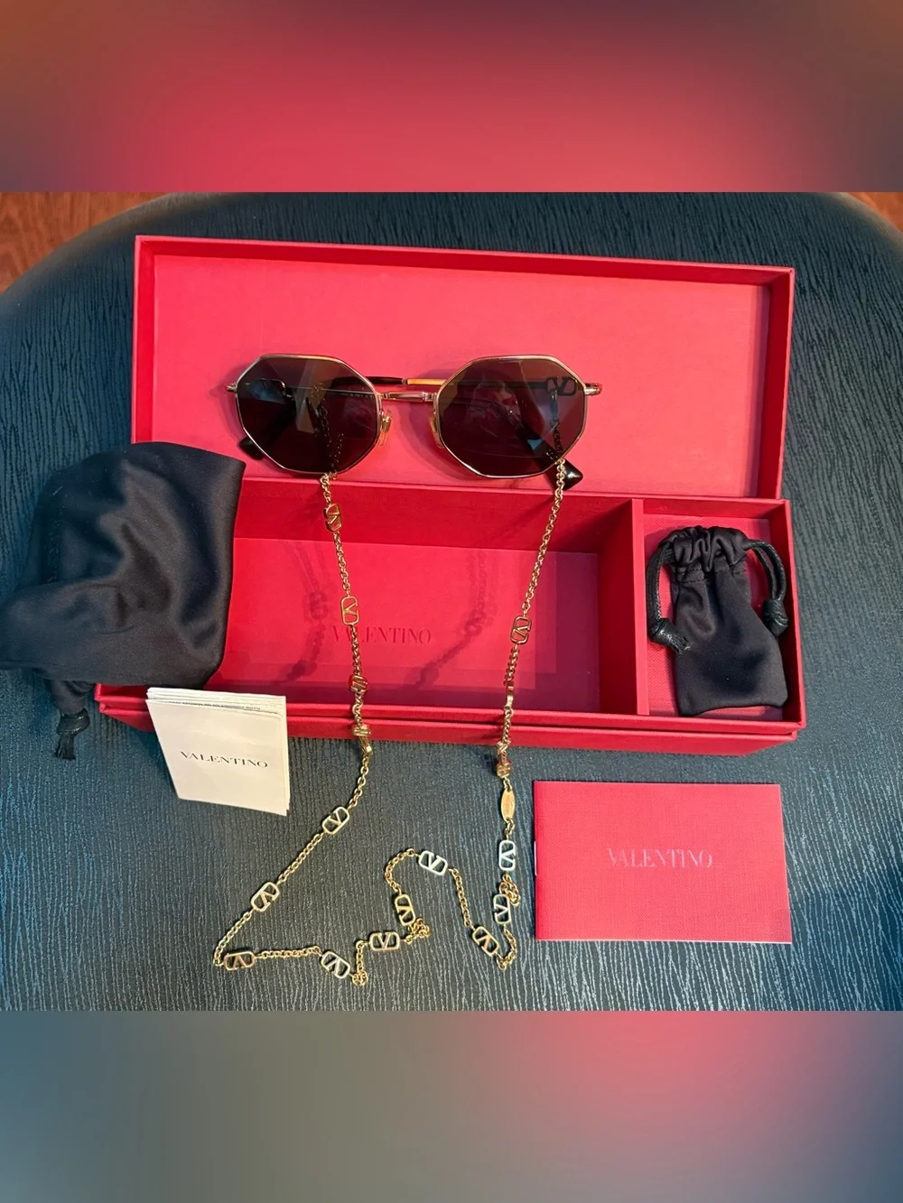 Valentino Garavani Octagonal Metal Sunglasses with a gold Vlogo chain